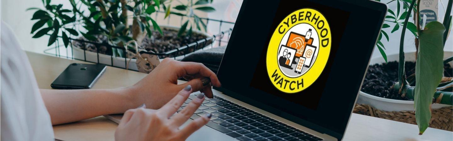 Image shows someone at a computer with the Cyberhood Watch logo